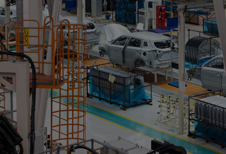 Cars being manufactured in a factory